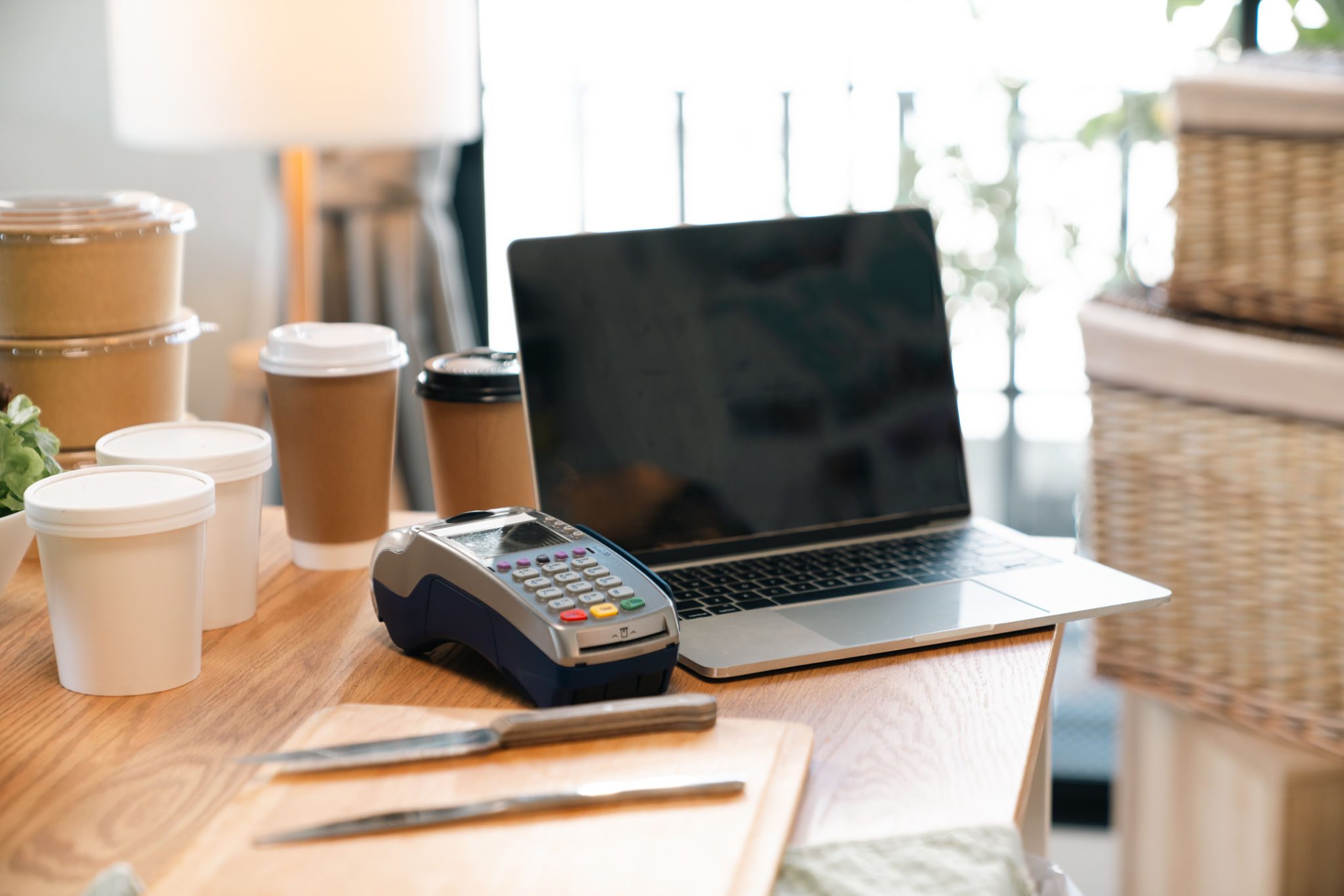 Coffee cups and laptop on a table