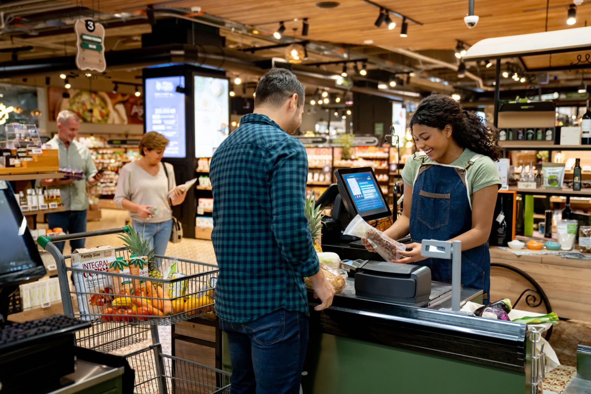 Grocery checkout with friendly cashier